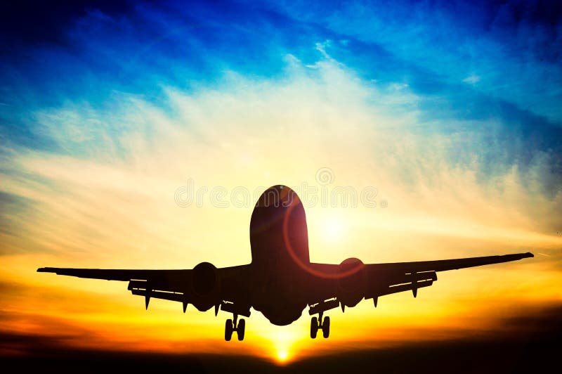 Coucher du soleil abstrait et avion photographie stock Coucher du soleil abstrait et avion photographie stock