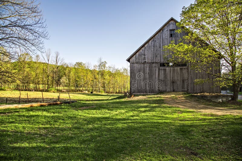 An idyllic country farm land landscape scene as sunsets on an old barn in Etna, New Hampshire. An idyllic country farm land landscape scene as sunsets on an old barn in Etna, New Hampshire.