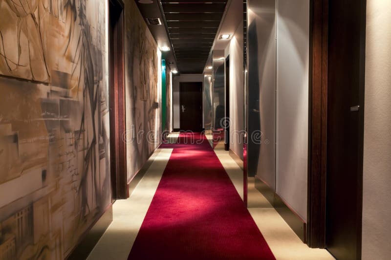 This is a photograph of a corridor in a five star hotel. This is a photograph of a corridor in a five star hotel