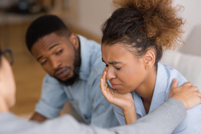 Counselor Comforting Desperate Afro Woman Crying At Couples Therapy stock images Counselor Comforting Desperate Afro Woman Crying At Couples Therapy stock images