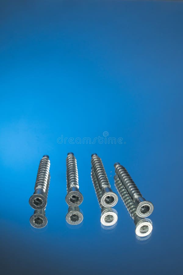 Countersunk Wood Screws on a Blue Background Stock Photo Image of chrome, engine 182516124
