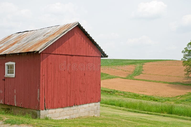 Country farm building and field