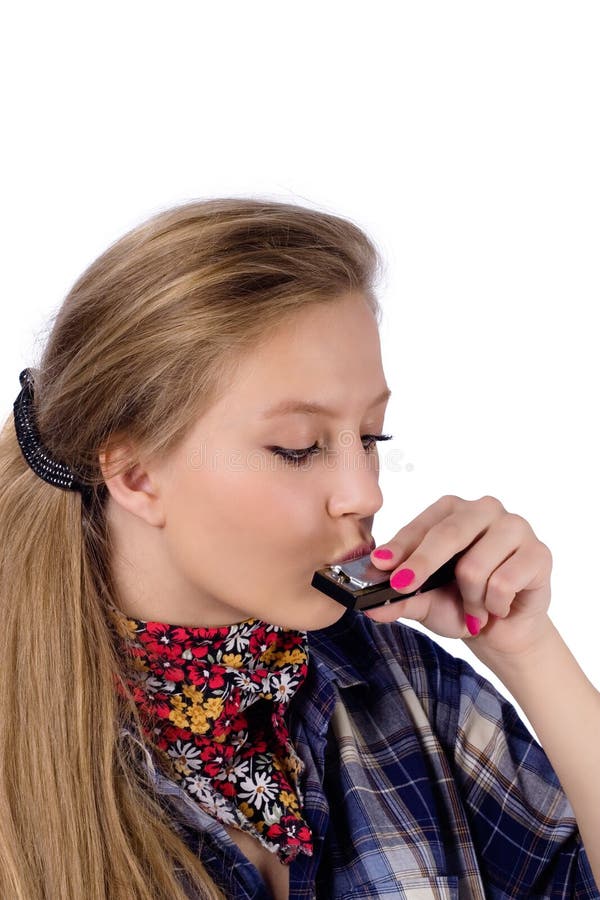 Portrait of country-girl in chequered shirt with harmonica. Portrait of country-girl in chequered shirt with harmonica