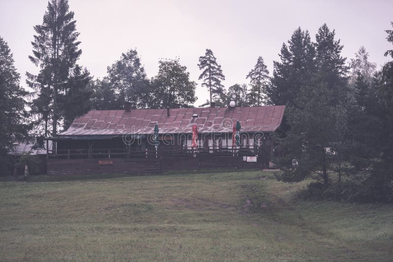 Country house with oak trees - vintage retro effect