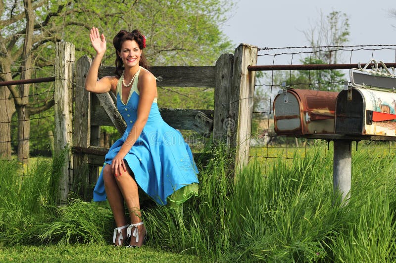 Country pin up girl in a farm