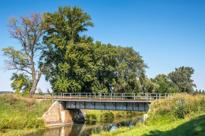 Countryside landscape railroad steel bridge over water canal stock photo Countryside landscape railroad steel bridge over water canal stock photo