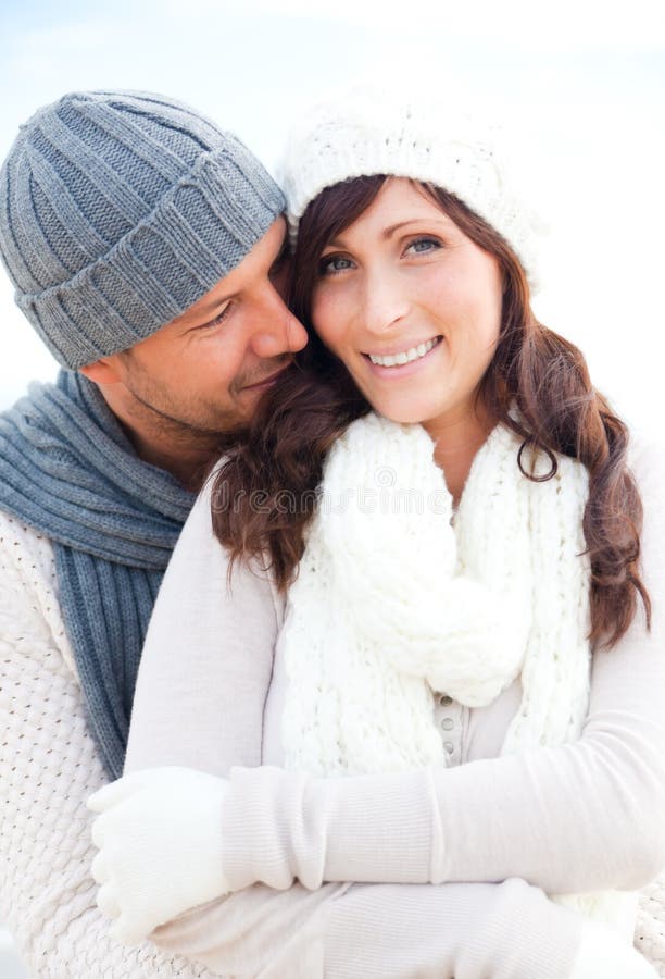 Happy outdoor autumn winter spring couple embracing