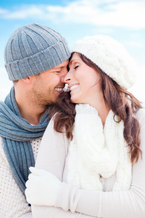 Happy outdoor autumn winter spring couple embracing