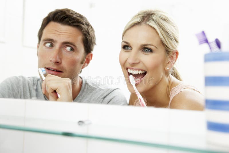 Couple In Bathroom Brushing Teeth royalty free stock photos Couple In Bathroom Brushing Teeth royalty free stock photos