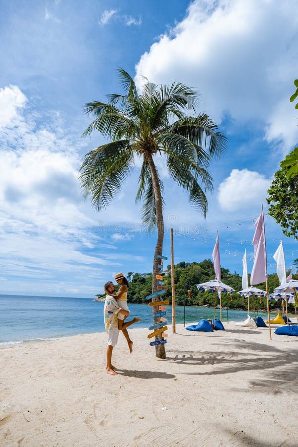 Couple On The Beach In Phuket Relaxing On Beach Chair Tropical Beach