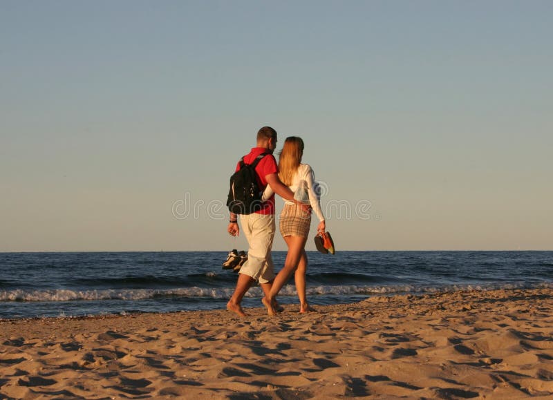 Couple during a beach stroll 2