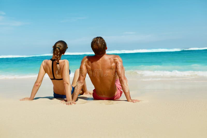 Couple On Beach In Summer. Romantic People On Sand At Resort royalty free stock photos Couple On Beach In Summer. Romantic People On Sand At Resort royalty free stock photos