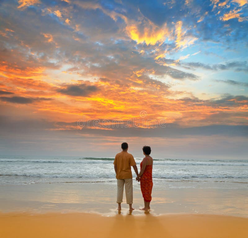 Couple on the beach at sunset