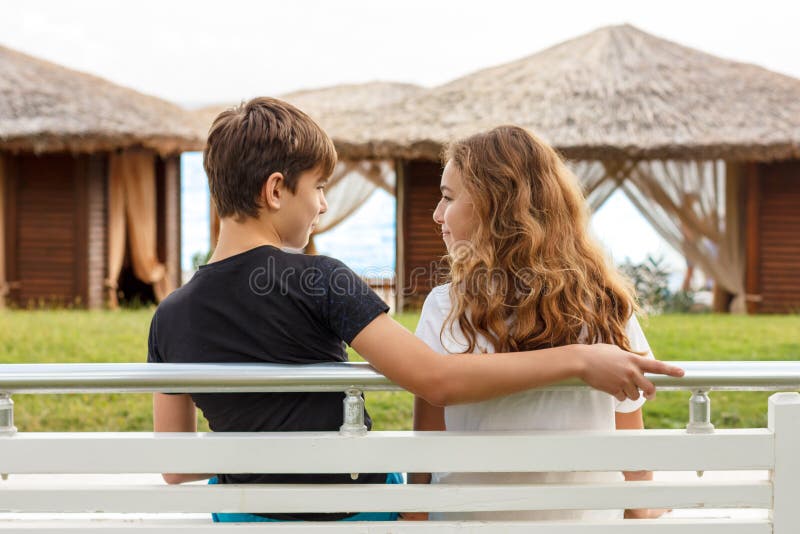 Girl Behind Boy Pretending Push Him Stock Photo 99733553