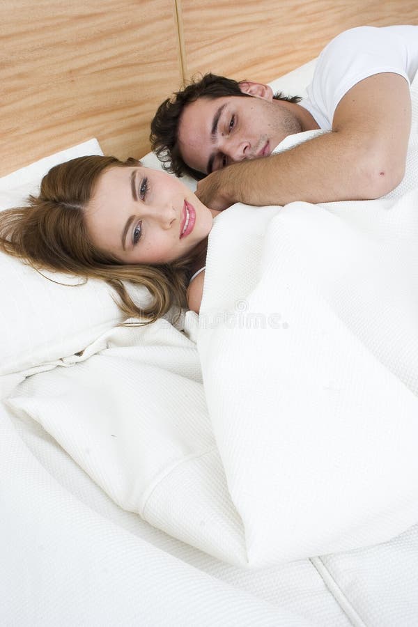 Lovely couple in bed stock image. Image of bedroom, female 35543585