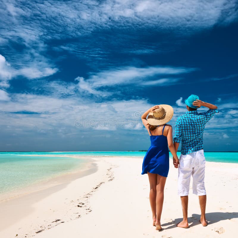 Couple in blue on a beach at Maldives royalty free stock photo Couple in blue on a beach at Maldives royalty free stock photo
