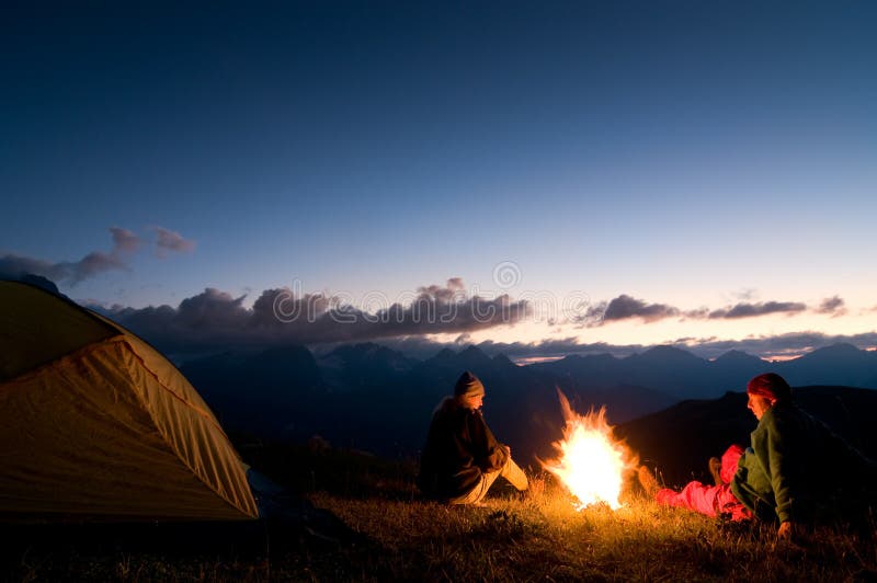 Couple camping at night