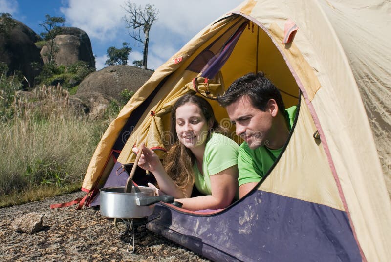 Couple Camping in Tent, Cooking