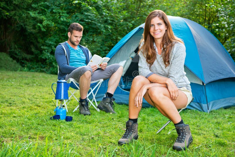 Couple on camping stock image. Image of meadow, field 33599557