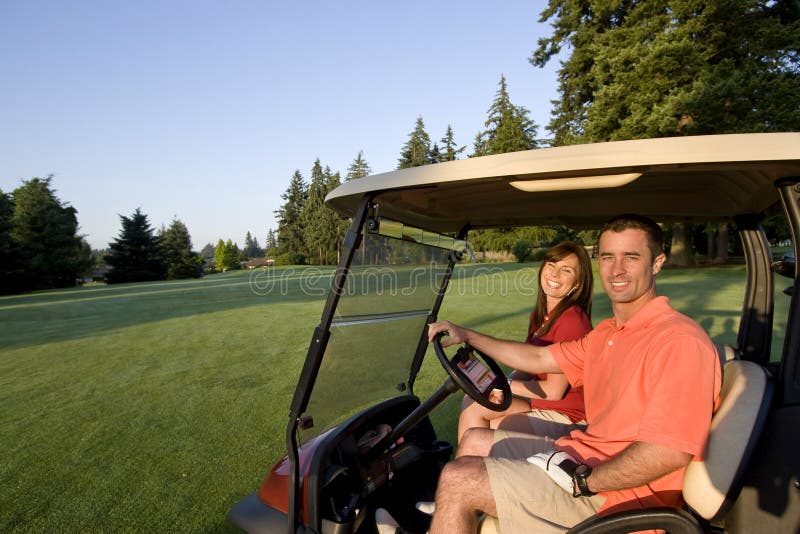 Couple in Cart on Golf Course - Horizontal