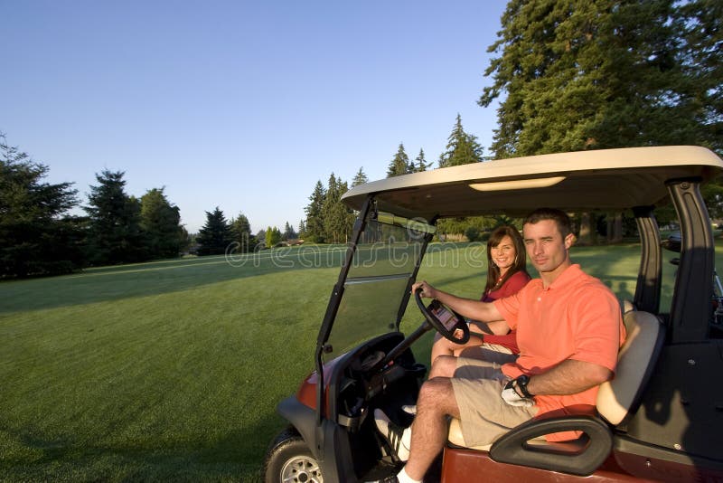 Couple in Cart on Golf Course - Horizontal