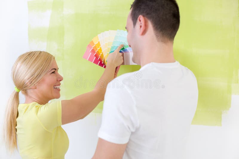 Couple Choosing a Color To Paint a Room Stock Image Image of cheerful