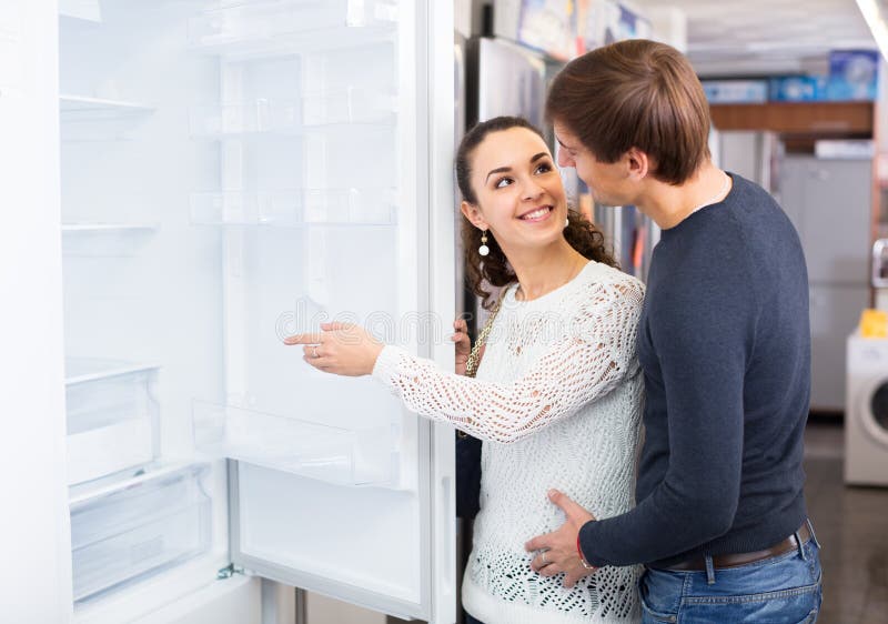 Couple Choosing New Refrigerator Stock Photo - Image of positive ...