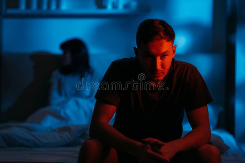 couple conflict domestic abuse aggressive man bed
