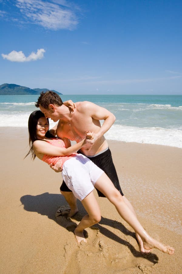 couple dancing at the beach