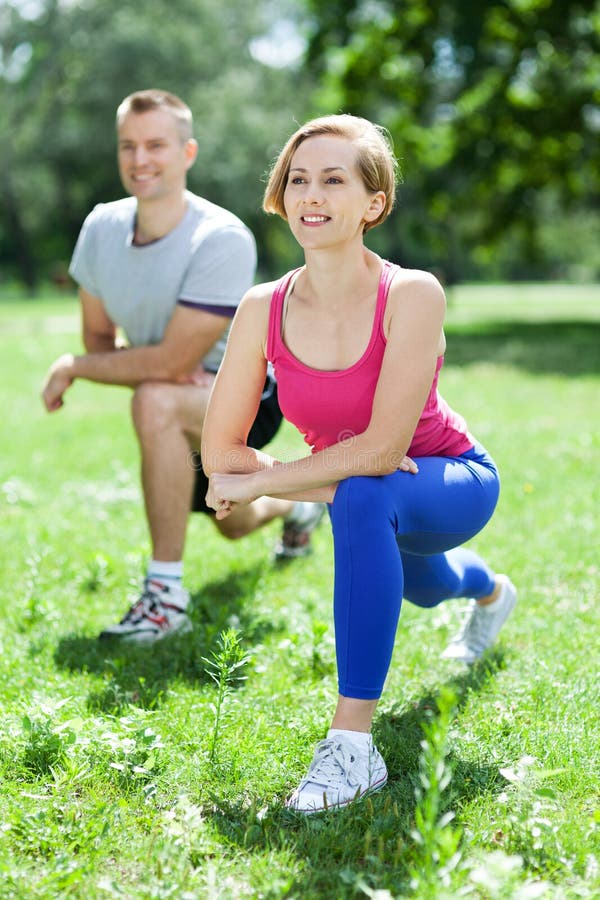 Couple doing stretching exercises royalty free stock photos Couple doing stretching exercises royalty free stock photos