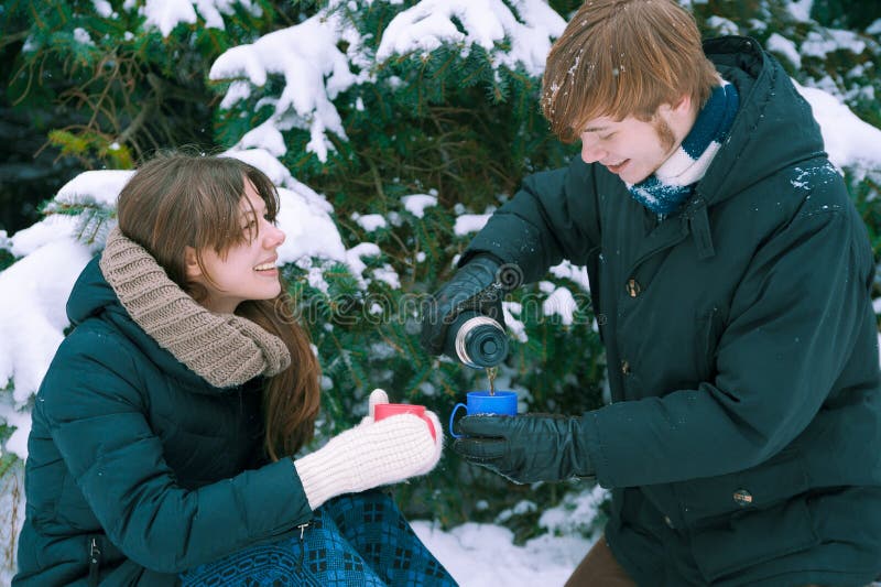 Couple drinking tea in winter