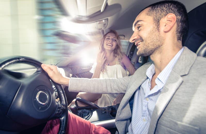 Couple driving fast on a sport car. stock images Couple driving fast on a sport car. stock images