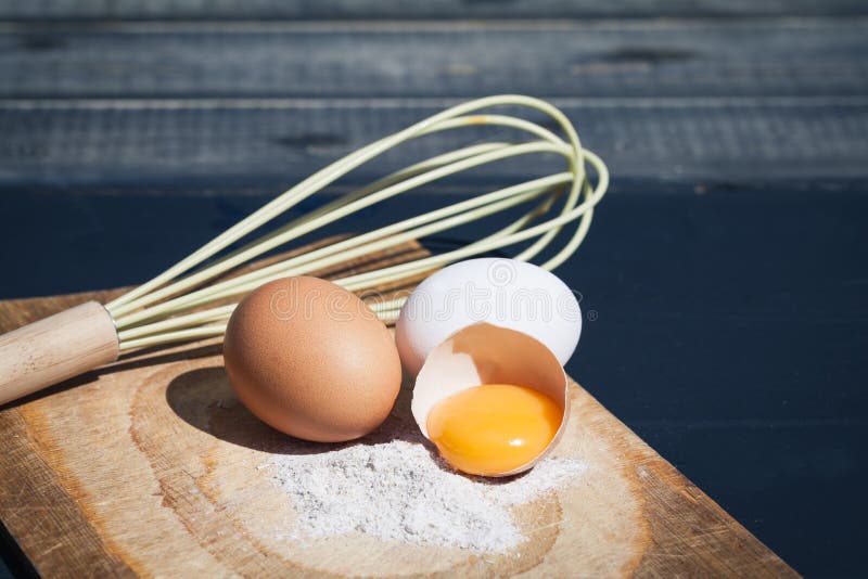 Young man holding young woman close against desk in empty classroom, tender post-climax embrace