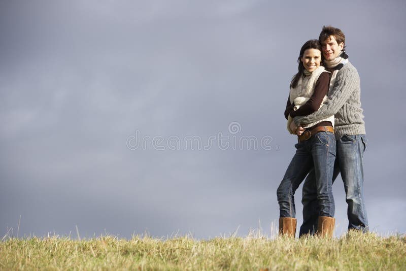 Young Couple Embracing In Park