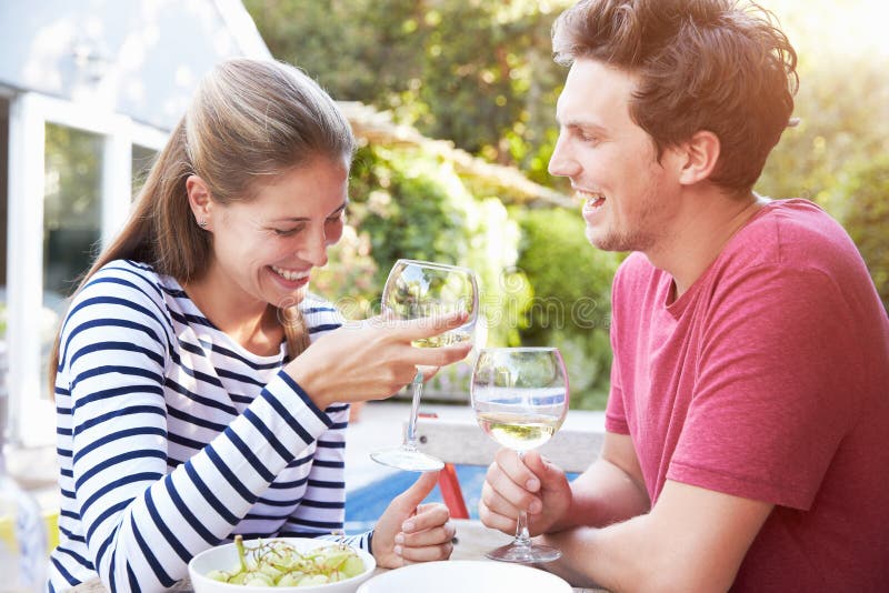 Couple Enjoying Outdoor Drinks in Garden Stock Photo Image of woman