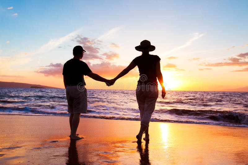 Couple Enjoying Sunset royalty free stock photography