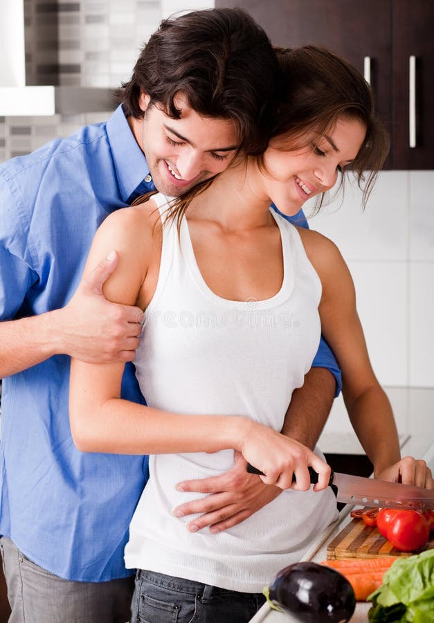 Couple enjoying their love in kitchen