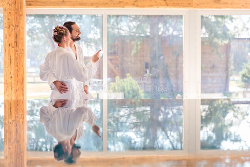 Couple enjoying view on wellness spa pool