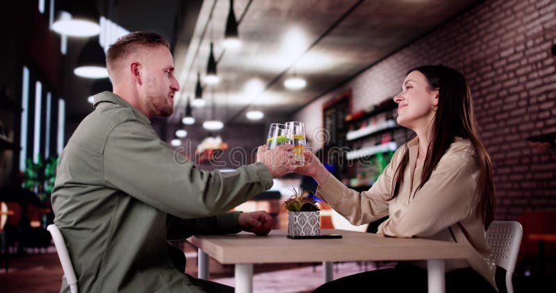 Couple Enjoying Wine And Dining stock photos