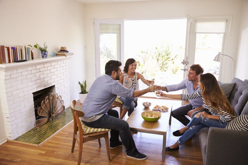 Couple Entertaining Friends at Home Stock Image Image of asian, mixed