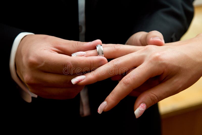 Couple Exchanges Rings during Wedding Ceremony. Stock Photo Image of