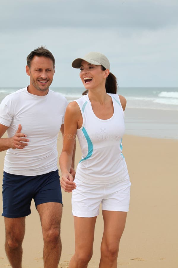 Couple exercising by the sea