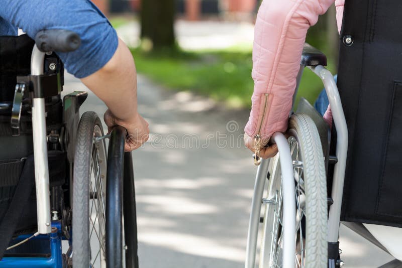 Couple of friends on a wheelchair