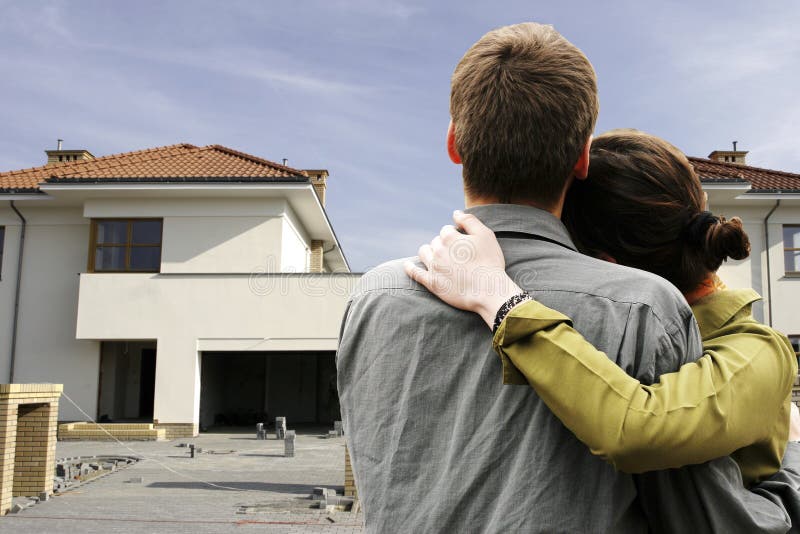 Couple in front of house stock photos Couple in front of house stock photos