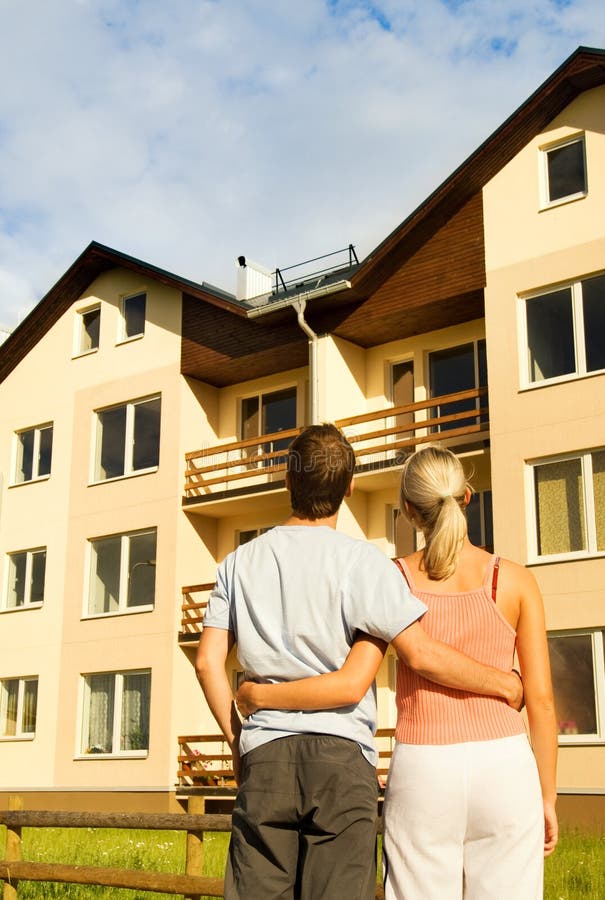 Couple in front of the house