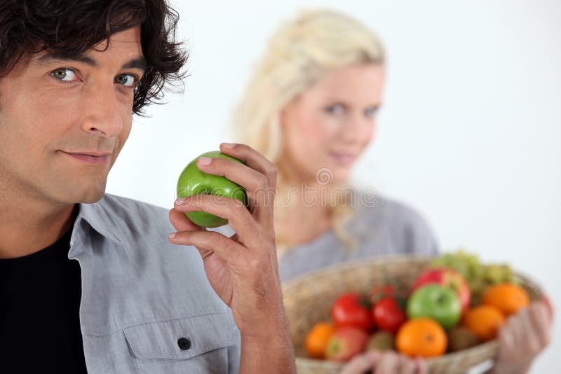 Couple with fruit basket stock image. Image of season 33278627