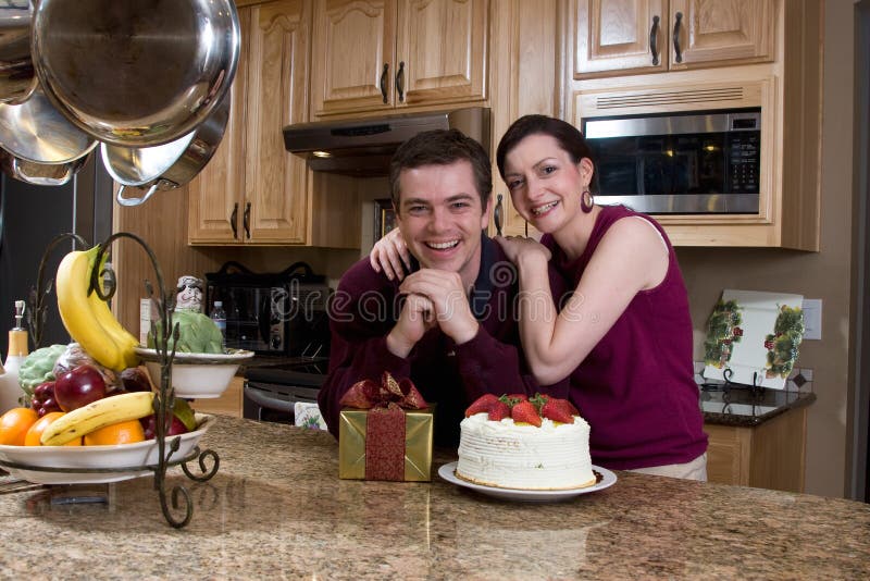 Couple With Gifts in the Kitchen - Horizontal
