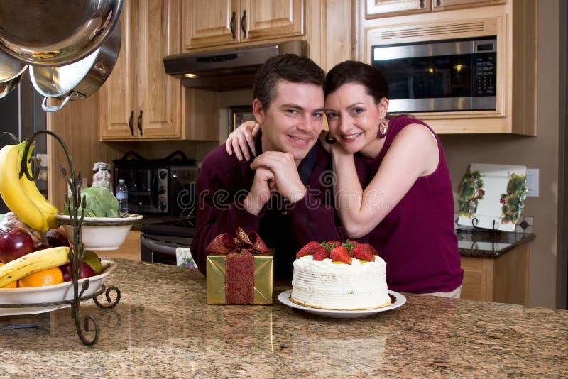 Couple With Gifts in the Kitchen - Horizontal