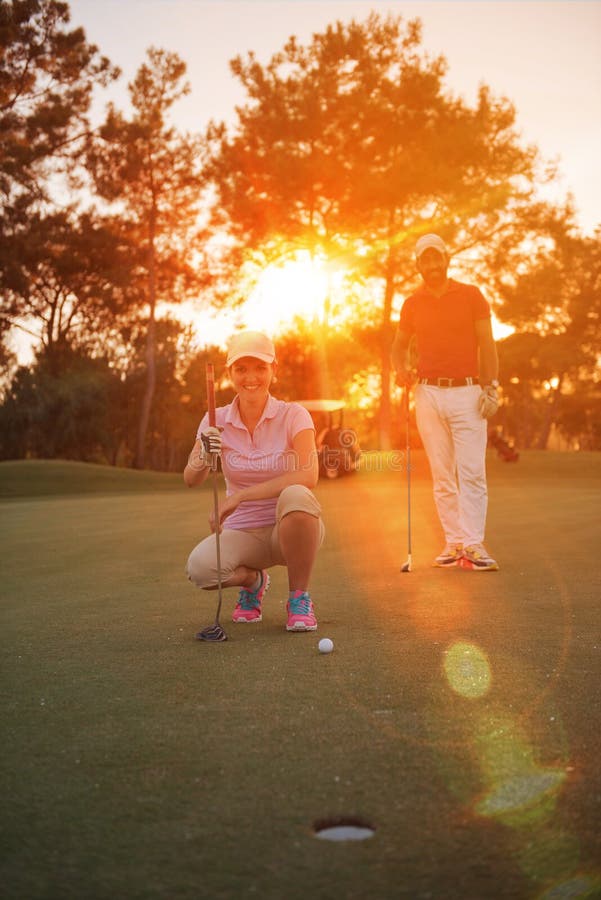 Couple on Golf Course at Sunset Stock Image Image of grass, golfer 71868759