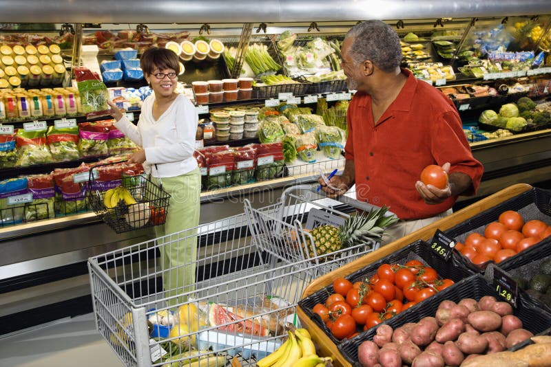 Couple grocery shopping. stock image Couple grocery shopping. stock image